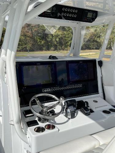 Slide: The Image of 2022 Freeman 37 VH boat cockpit with advanced navigation system and controls. - 11