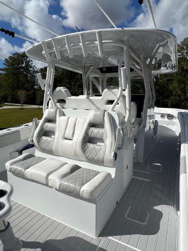 Slide: The Image of 2022 Freeman 37 VH boat with luxurious white seating and canopy. - 5