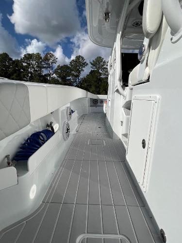 Slide: The Image of 2022 Freeman 37 VH boat deck with storage compartments and seating. - 7