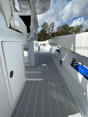 Slide: The Image of 2022 Freeman 37 VH boat deck with storage compartments and fishing rod holders. - 8