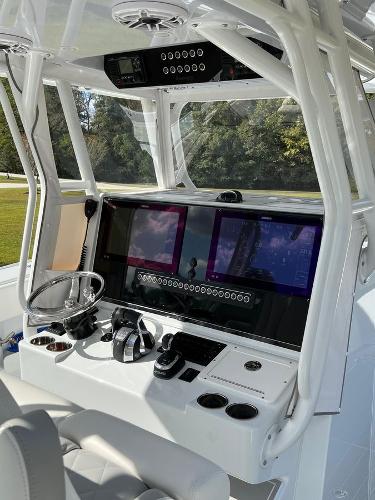 Slide: The Image of 2022 Freeman 37 VH boat cockpit with advanced navigation system and controls. - 9