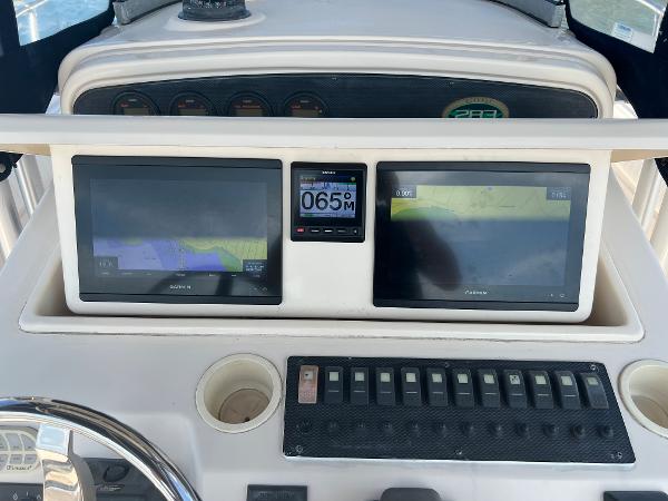 Slide: The Image of Control panel of 2005 Grady-White 283 RELEASE boat with navigation screens and gauges. - 10