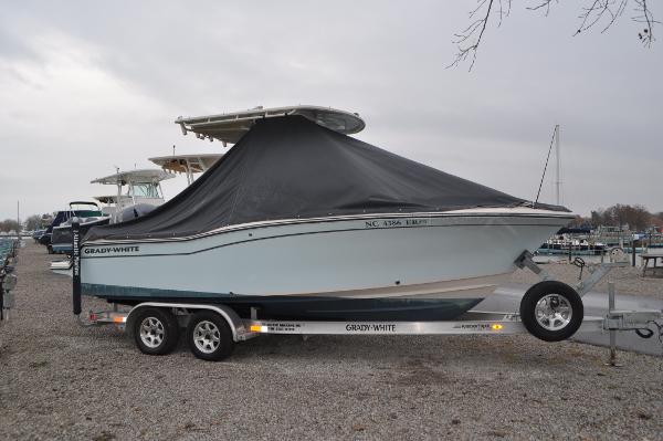 Slide: The Image of 2021 Grady-White Fisherman 216 boat on trailer, covered, parked outdoors. - 35