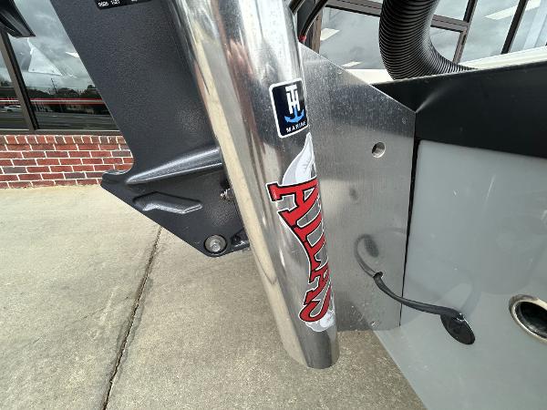 Slide: The Image of Close-up of 2024 Hewes Redfisher 18 boat's engine mount and hydraulic system. - 14