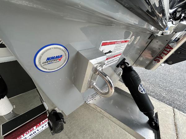 Slide: The Image of 2024 Hewes Redfisher 18 boat transom with NMMI certification sticker. - 18
