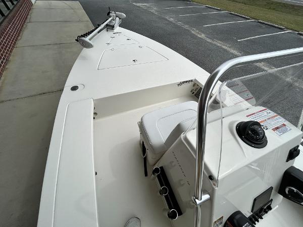 Slide: The Image of 2024 Hewes Redfisher 18 boat deck with steering console and seating. - 22