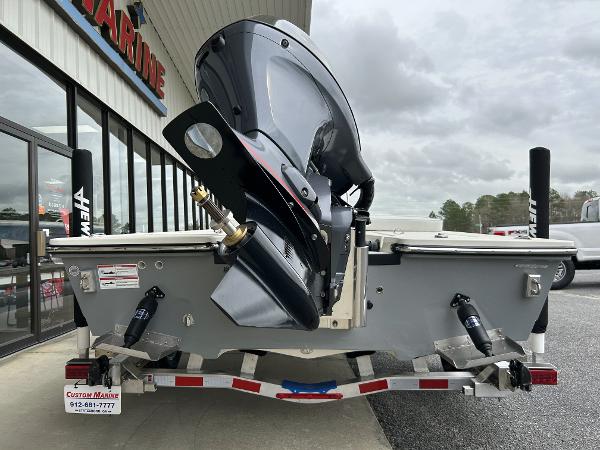 Slide: The Image of 2024 Hewes Redfisher 18 boat on trailer, rear view with outboard motor. - 28