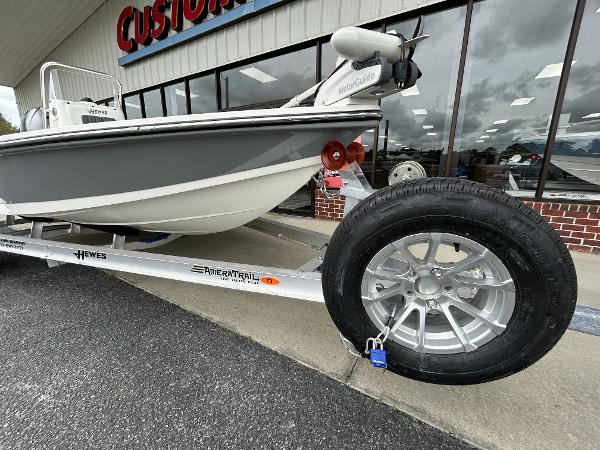 Slide: The Image of 2024 Hewes Redfisher 18 boat on trailer outside dealership. - 5