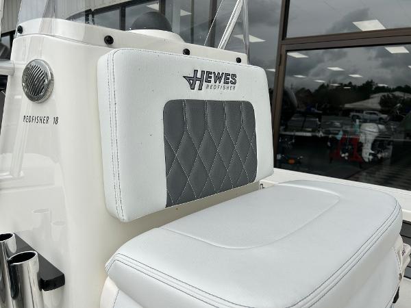 Slide: The Image of 2024 Hewes Redfisher 18 boat seat with logo and diamond-stitched upholstery. - 9