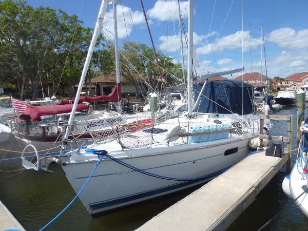 Slide: The Image of 2001 Hunter 420 Passage sailboat docked at marina on a sunny day. - 0