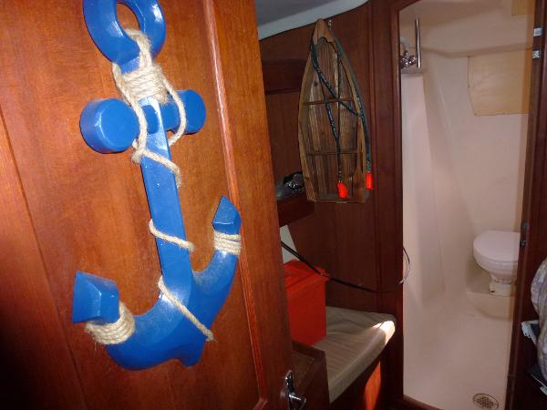 Slide: The Image of Interior of 2001 Hunter 420 Passage sailboat with nautical decor and bathroom. - 17