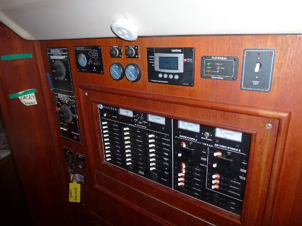 Slide: The Image of Control panel of a 2001 Hunter 420 Passage sailboat with various gauges and switches. - 29