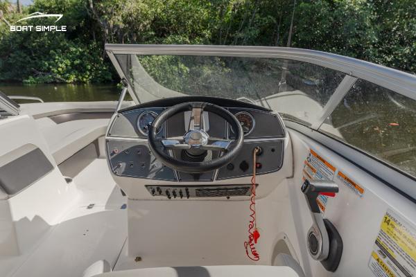 Slide: The Image of 2022 Hurricane 217 SD boat dashboard and steering wheel. - 7