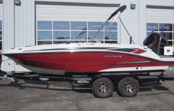Slide: The Image of 2023 Hurricane SunDeck Sport 205 OB boat on a trailer outside a dealership. - 1