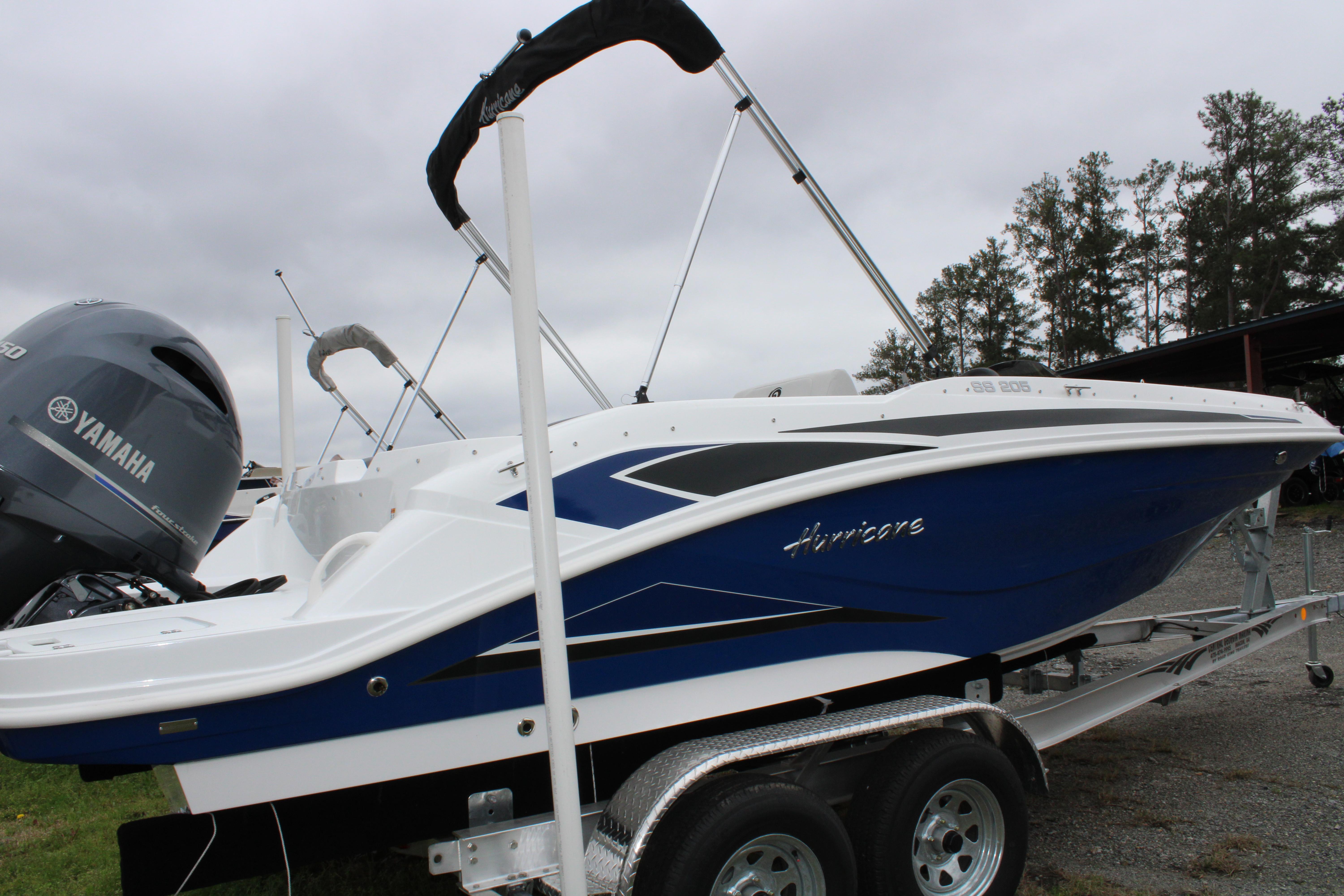 Slide: The Image of 2023 Hurricane SunDeck Sport 205 OB boat on trailer with Yamaha outboard motor. - 10