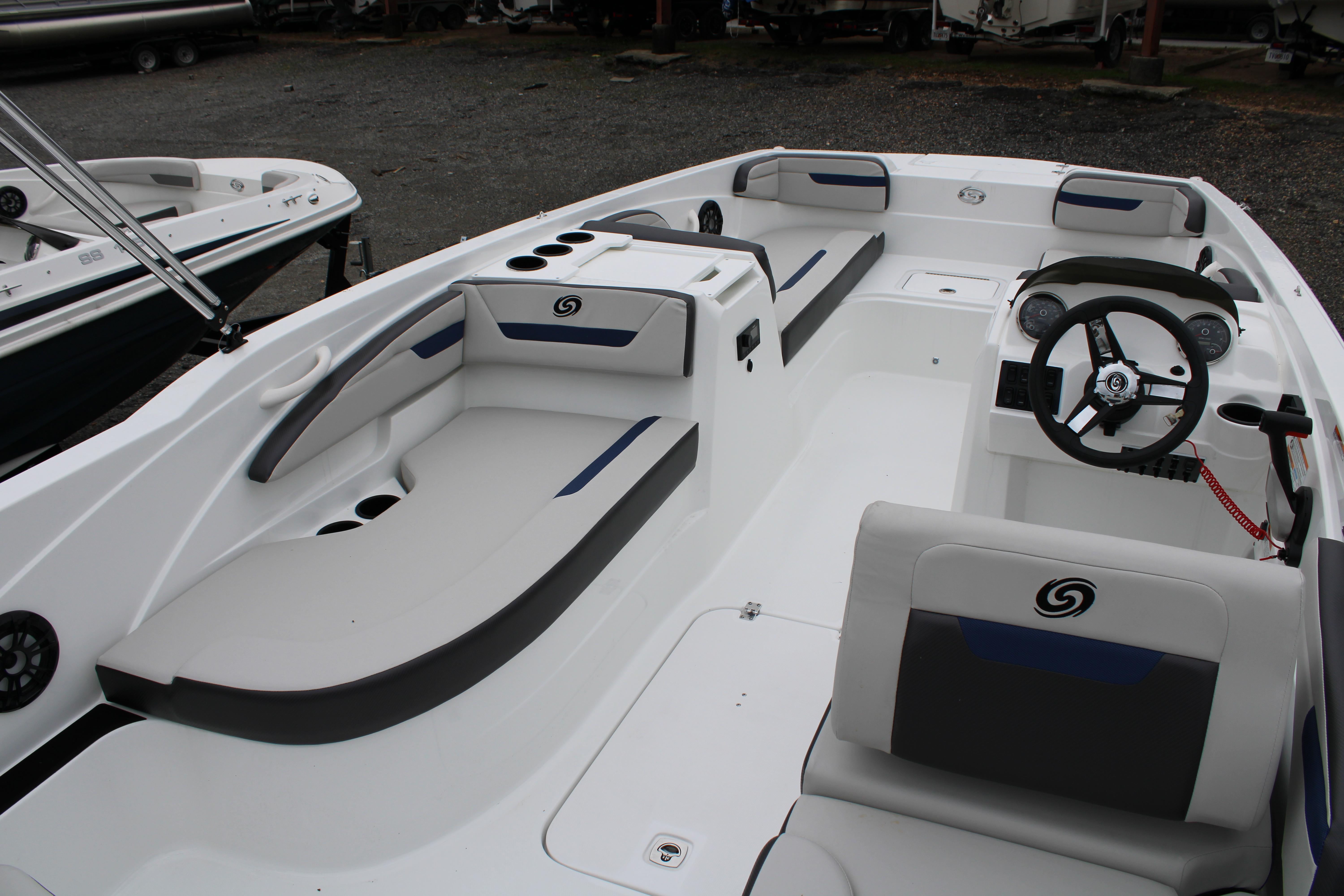Slide: The Image of 2023 Hurricane SunDeck Sport 205 OB boat interior with seating and steering console. - 12