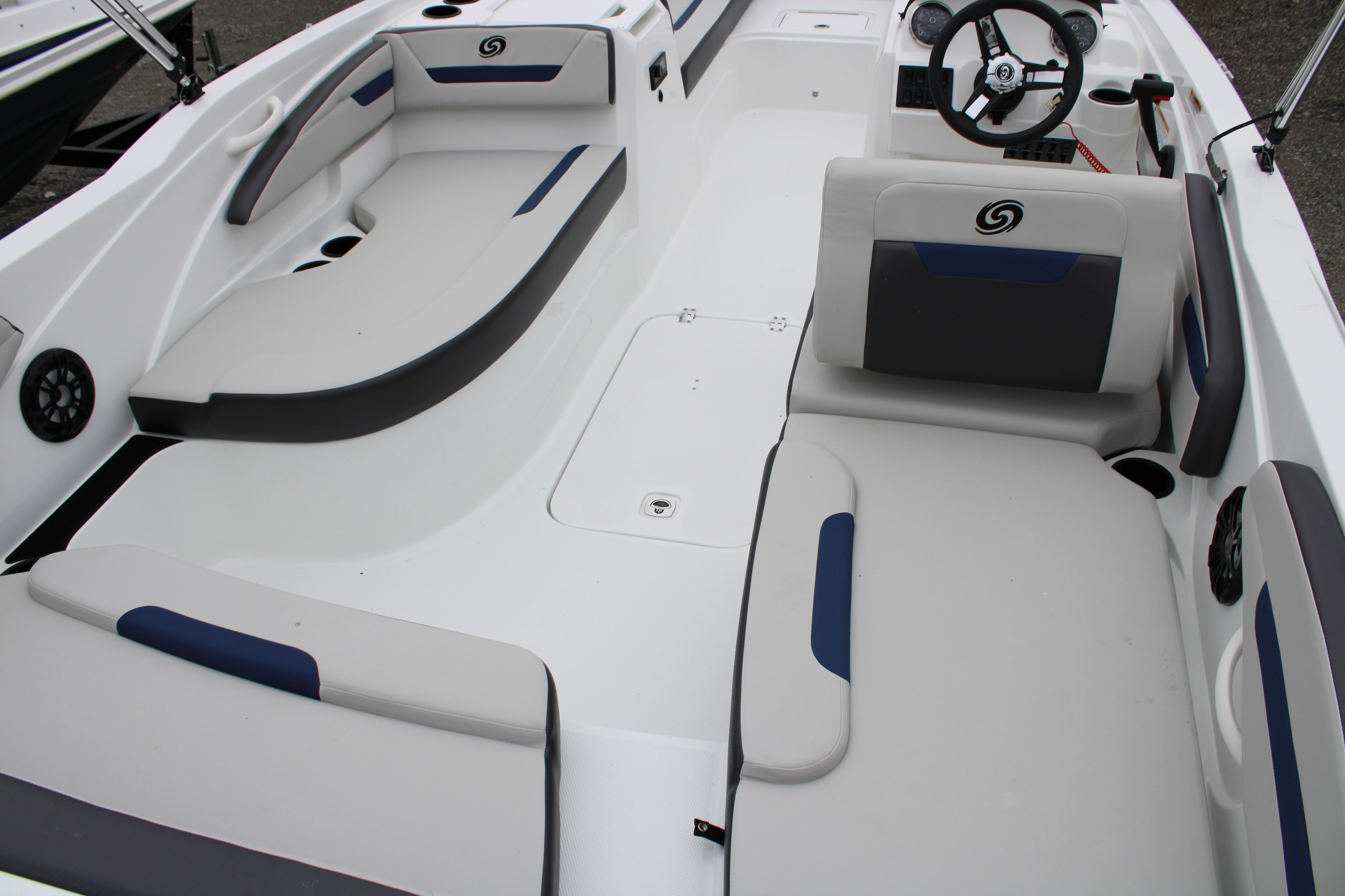 Slide: The Image of 2023 Hurricane SunDeck Sport 205 OB boat interior with seating and steering wheel. - 13
