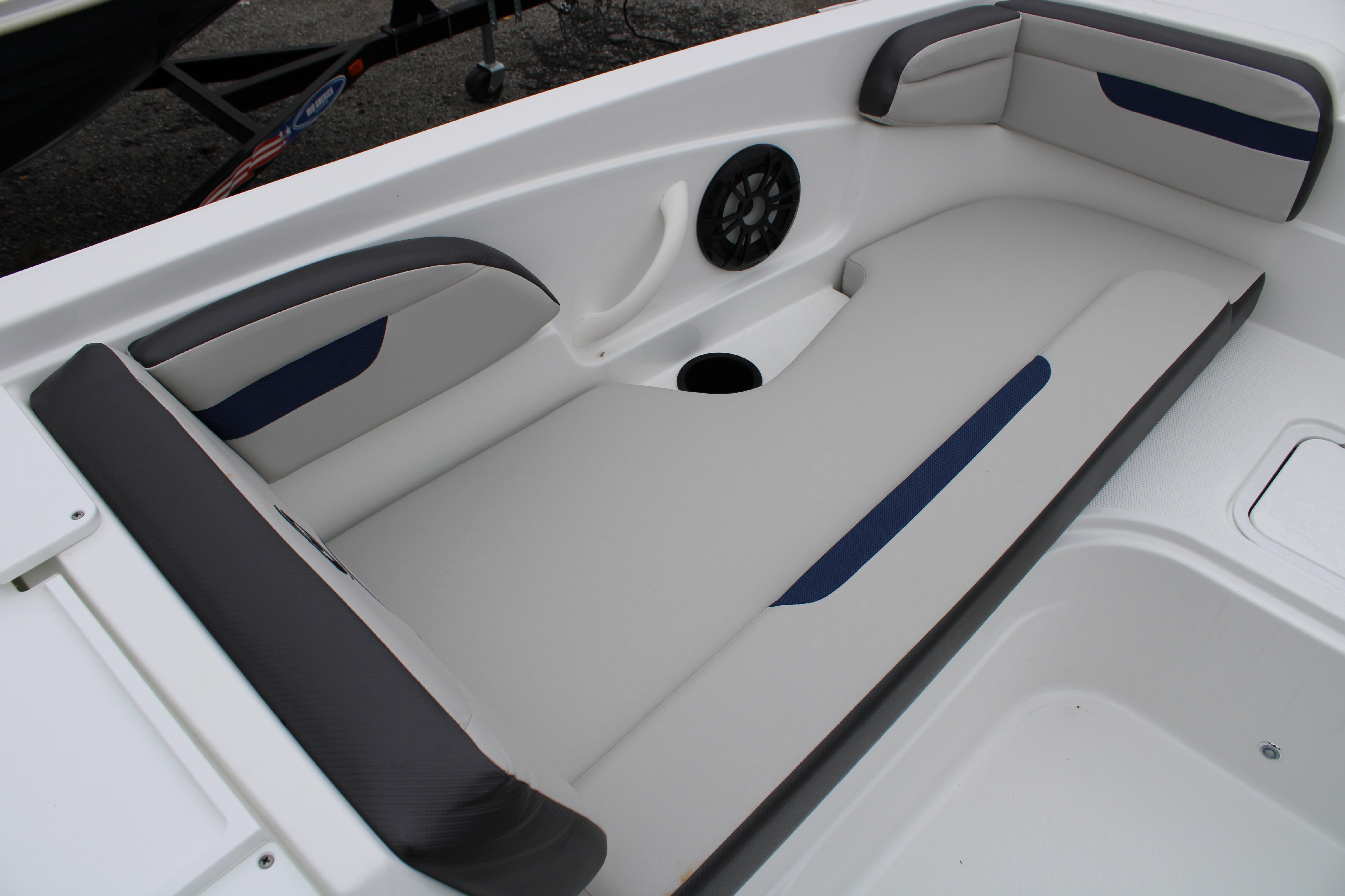 Slide: The Image of 2023 Hurricane SunDeck Sport 205 OB boat interior seating area with cup holder and speaker. - 17