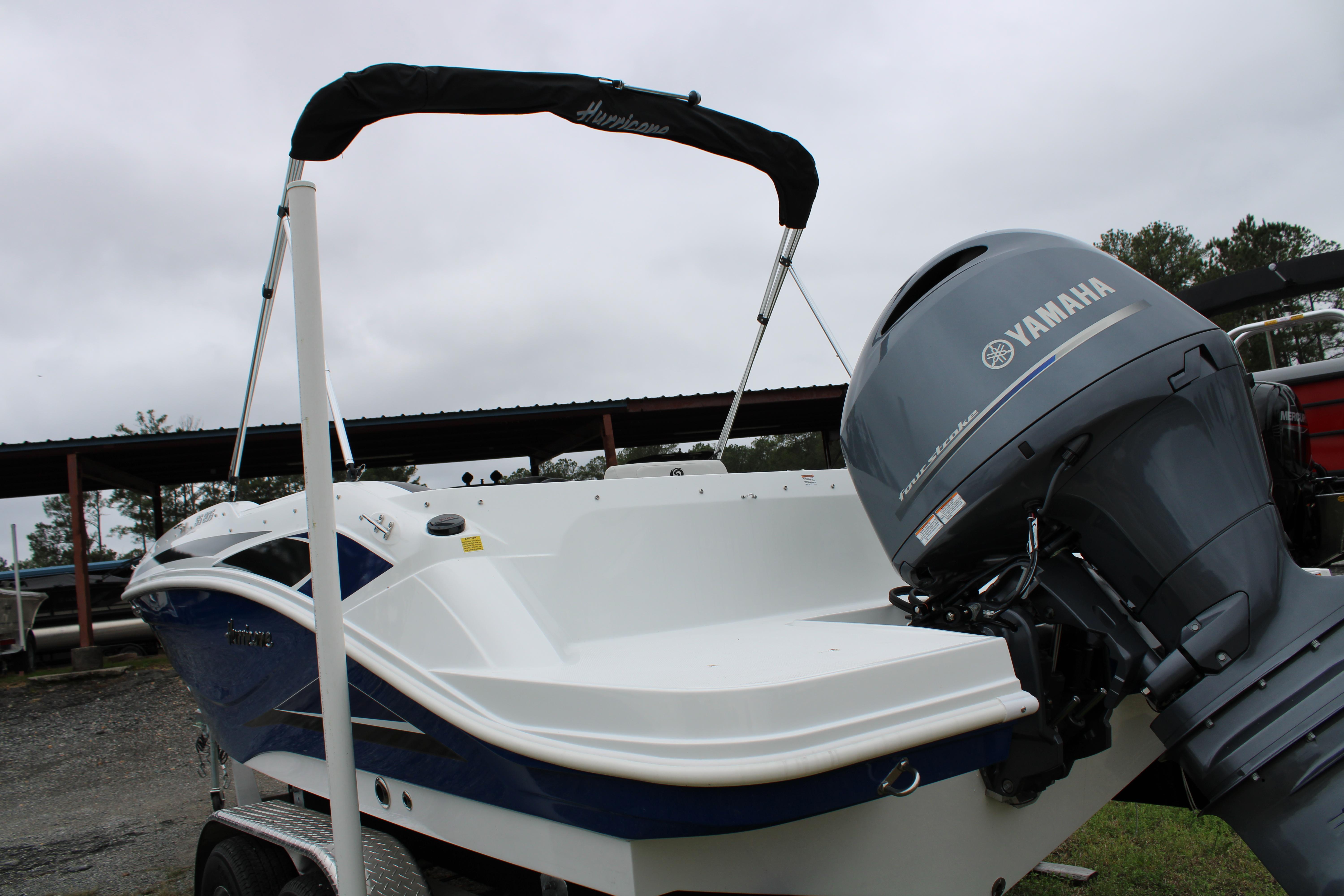Slide: The Image of 2023 Hurricane SunDeck Sport 205 OB boat with Yamaha outboard motor. - 3