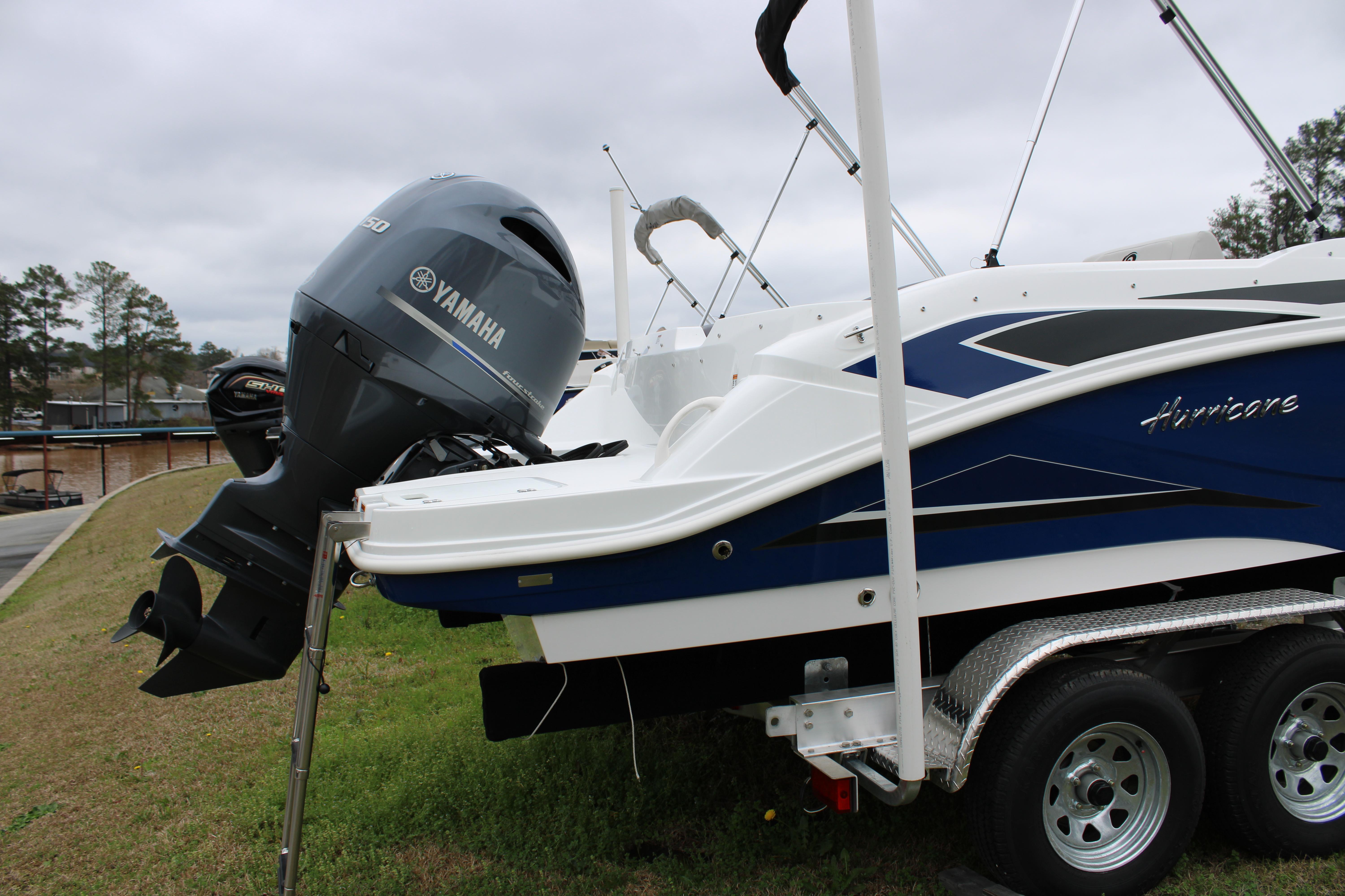Slide: The Image of 2023 Hurricane SunDeck Sport 205 OB boat with Yamaha outboard motor on trailer. - 5
