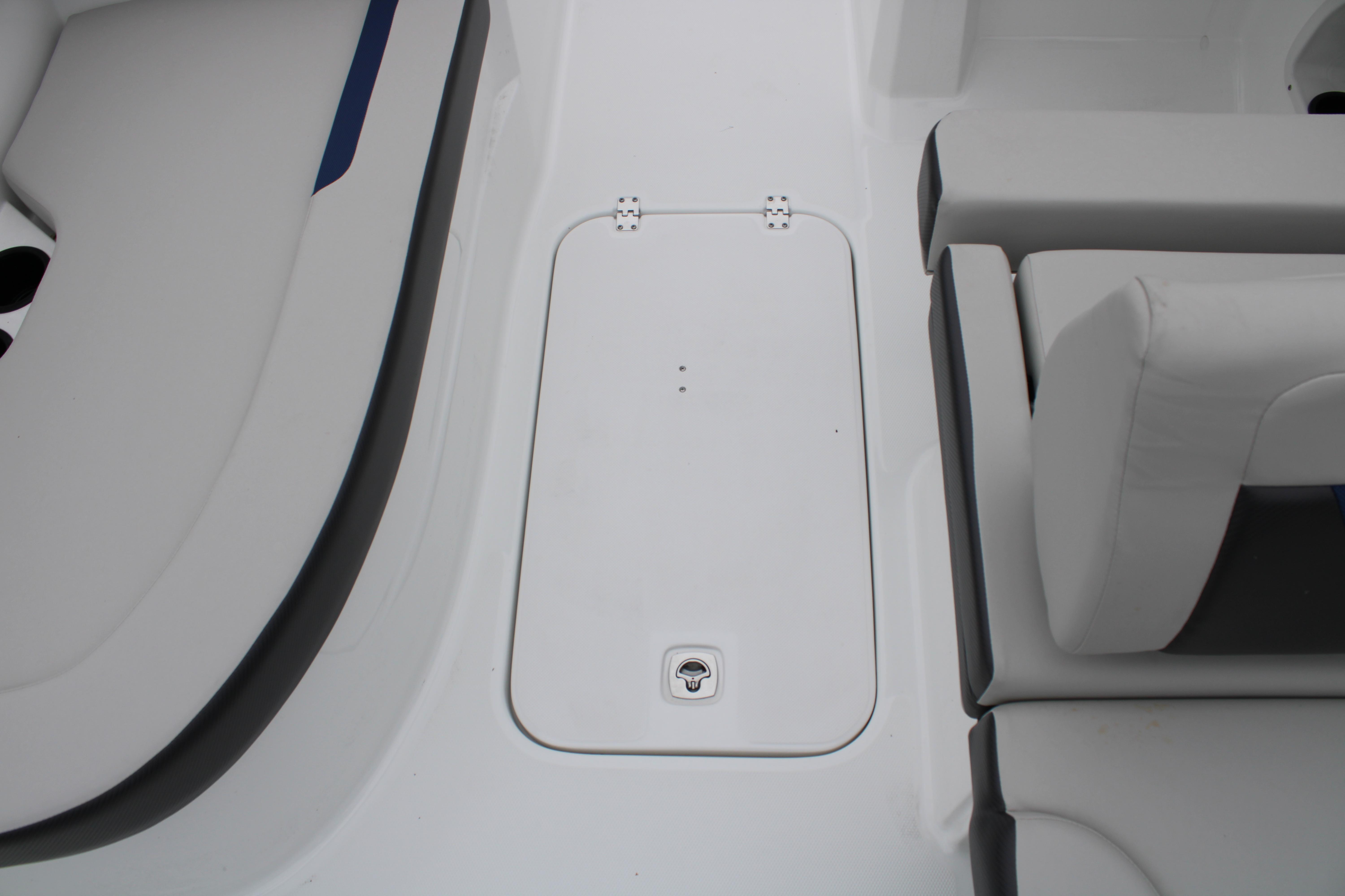Slide: The Image of 2023 Hurricane SunDeck Sport 205 OB boat interior with storage compartment. - 7
