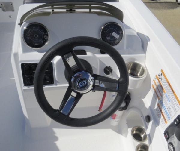 Slide: The Image of 2023 Hurricane SunDeck Sport 205 OB boat dashboard with steering wheel and gauges. - 9