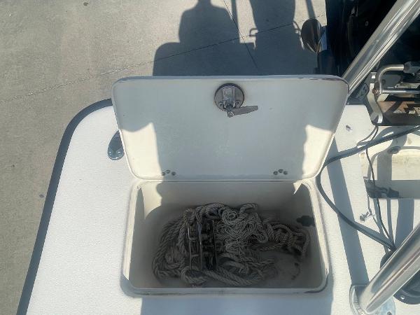 Slide: The Image of Open storage compartment on a 2006 Intruder Pro Marine 20 boat with rope inside. - 6