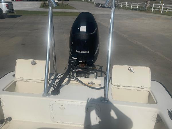 Slide: The Image of 2006 Intruder Pro Marine 20 boat with Suzuki outboard motor in a parking lot. - 8