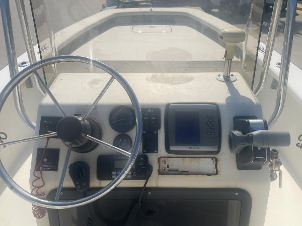 Slide: The Image of 2006 Intruder Pro Marine 20 boat dashboard with steering wheel and navigation instruments. - 9