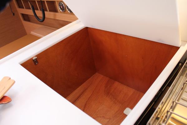 Slide: The Image of Open storage compartment on 2025 Jeanneau Sun Odyssey 440 yacht interior. - 24