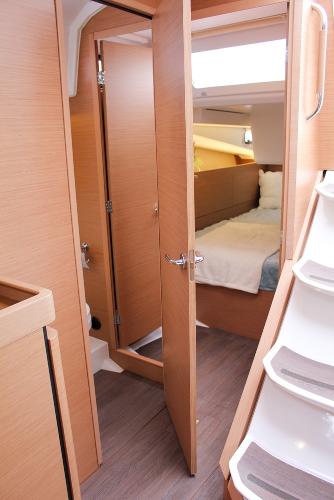 Slide: The Image of Interior of 2025 Jeanneau Sun Odyssey 440 yacht, featuring a cozy cabin and modern design. - 34