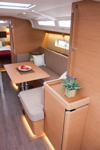 Slide: The Image of Interior of 2025 Jeanneau Sun Odyssey 440, featuring modern seating and dining area. - 42