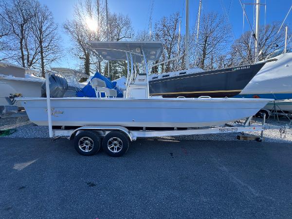 Slide: The Image of 2025 KenCraft 2260FS Bay Rider Skiff on trailer in boatyard. - 0