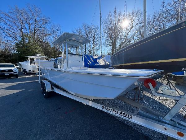 Slide: The Image of 2025 KenCraft 2260FS Bay Rider Skiff on trailer in marina. - 1