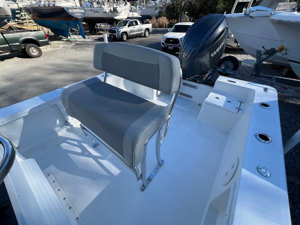 Slide: The Image of 2025 KenCraft 2260FS Bay Rider Skiff with Yamaha outboard engine, docked at marina. - 9