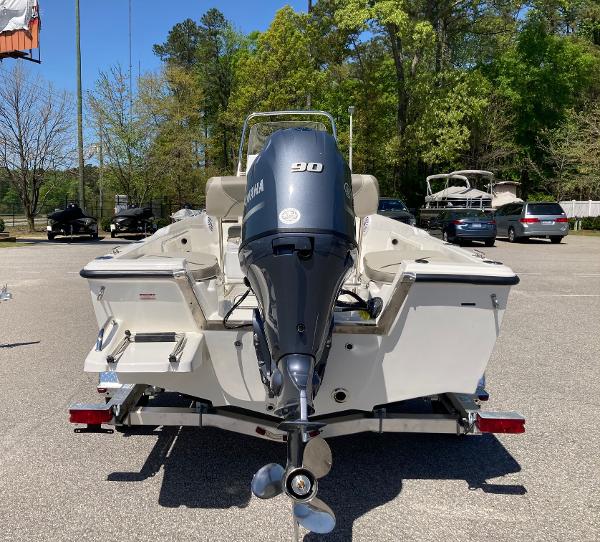 Slide: The Image of 2024 Key West 1720 Sportsman boat with Yamaha 90 engine, rear view in parking lot. - 1