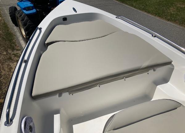 Slide: The Image of 2024 Key West 1720 Sportsman boat interior with cushioned seating. - 6