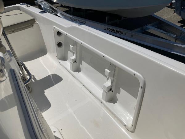 Slide: The Image of 2024 Key West 1720 Sportsman boat interior, showing storage compartments and seating area. - 8
