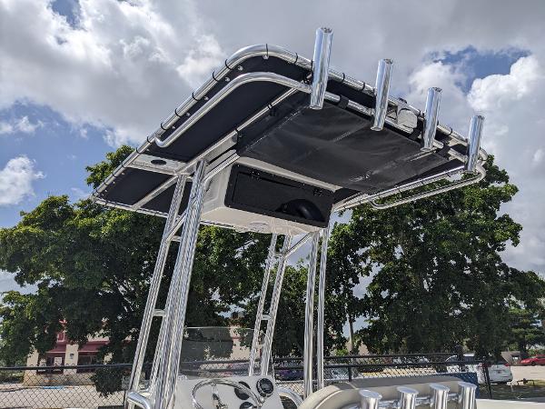 Slide: The Image of 2024 Key West 188 Bay Reef boat with T-top and rod holders. - 13