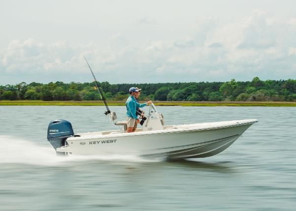 Slide: The Image of 2024 Key West 188 Bay Reef boat cruising on a lake. - 14