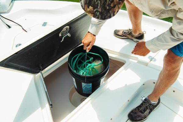 Slide: The Image of Man organizing fishing gear on 2024 Key West 188 Bay Reef boat. - 20