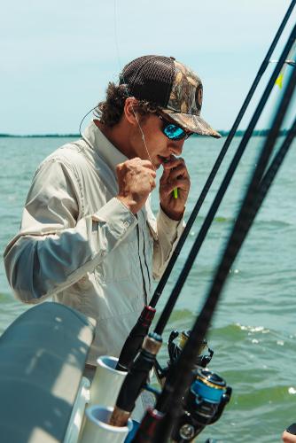 Slide: The Image of Man fishing on a 2024 Key West 188 Bay Reef boat. - 21