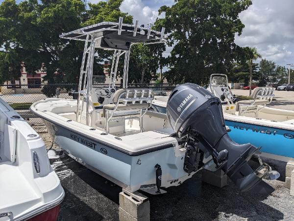Slide: The Image of 2024 Key West 188 Bay Reef boat with Yamaha outboard motor, docked on blocks. - 3