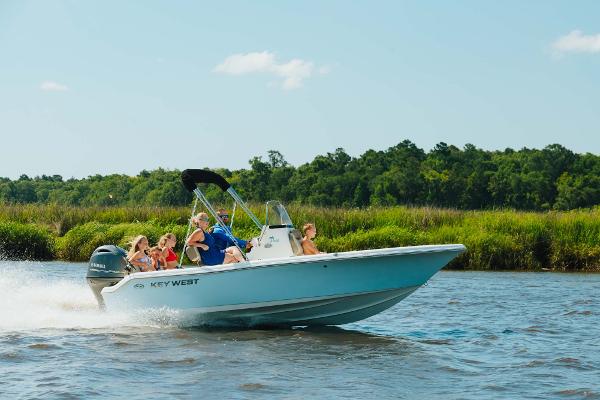 Slide: The Image of 2024 Key West 189 FS boat cruising on a river with passengers. - 10