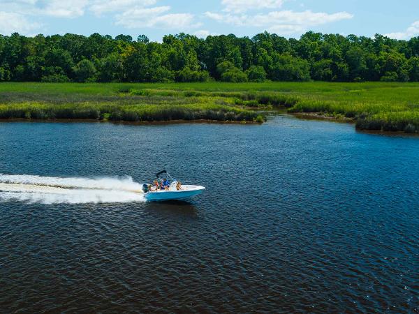 Slide: The Image of 2024 Key West 189 FS boat cruising on a scenic river. - 11