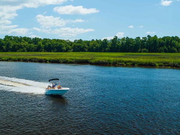 Slide: The Image of 2024 Key West 189 FS boat cruising on a scenic river. - 12