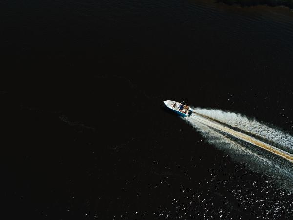 Slide: The Image of Aerial view of 2024 Key West 189 FS boat cruising on dark water. - 13