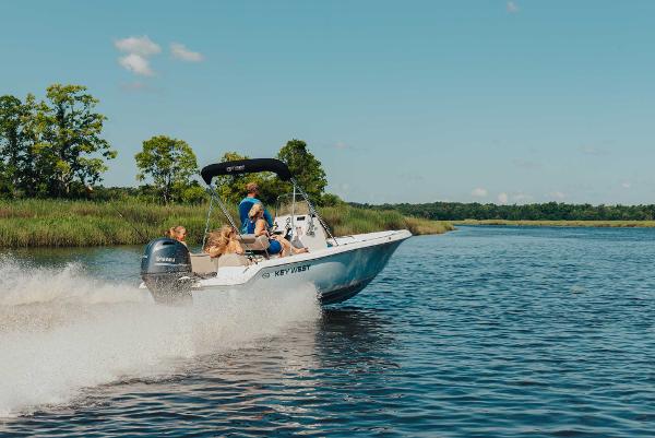 Slide: The Image of 2024 Key West 189 FS boat cruising on a scenic river. - 16
