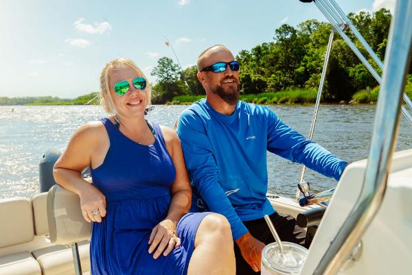 Slide: The Image of Couple enjoying a sunny day on a 2024 Key West 189 FS boat. - 18