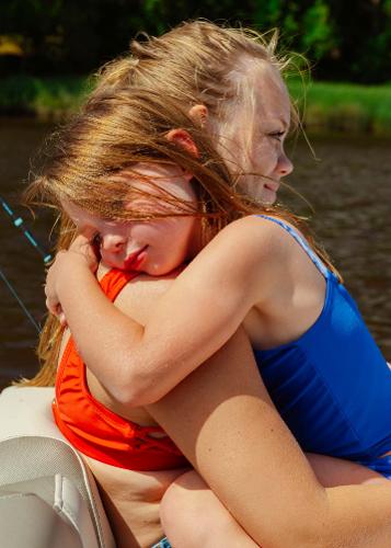 Slide: The Image of Two children hugging on a 2024 Key West 189 FS boat. - 20